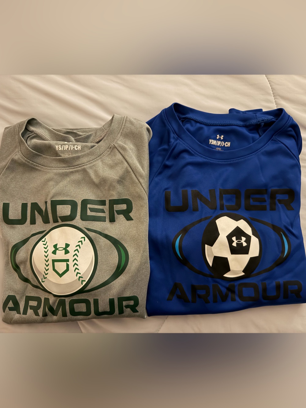 2 boys size small Under Armour T-shirts